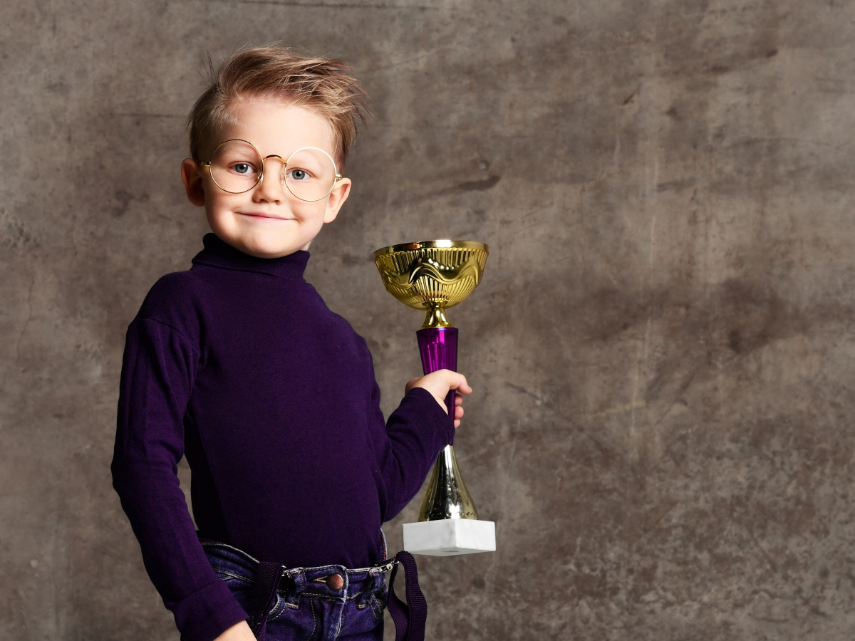 Student’s mother storms headmistress’s office demanding that Canterbury recognize child’s athletic achievements. In response, Canterbury will now force all students to accept participation awards even without participation